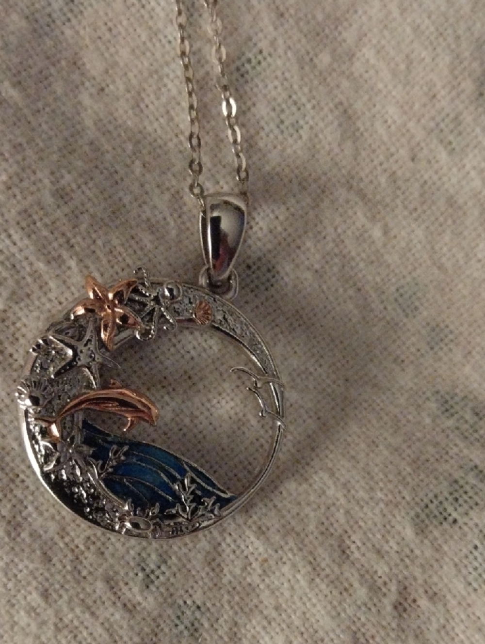 Silver-tone Blue Wave Pendant Necklace with Rose Gold Accents